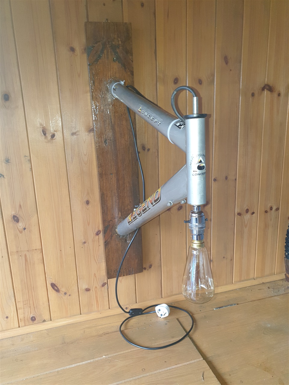 Mountain bike frame converted to wall lamp